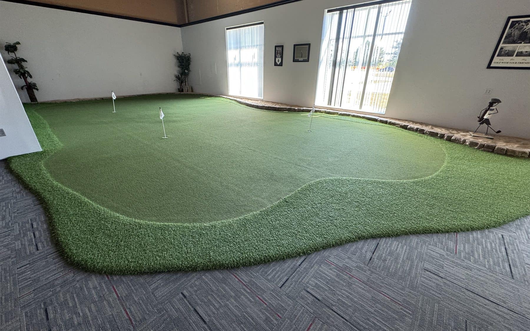 Indoor putting green near the golf simulators at On The Dunes Sports in Commerce Township